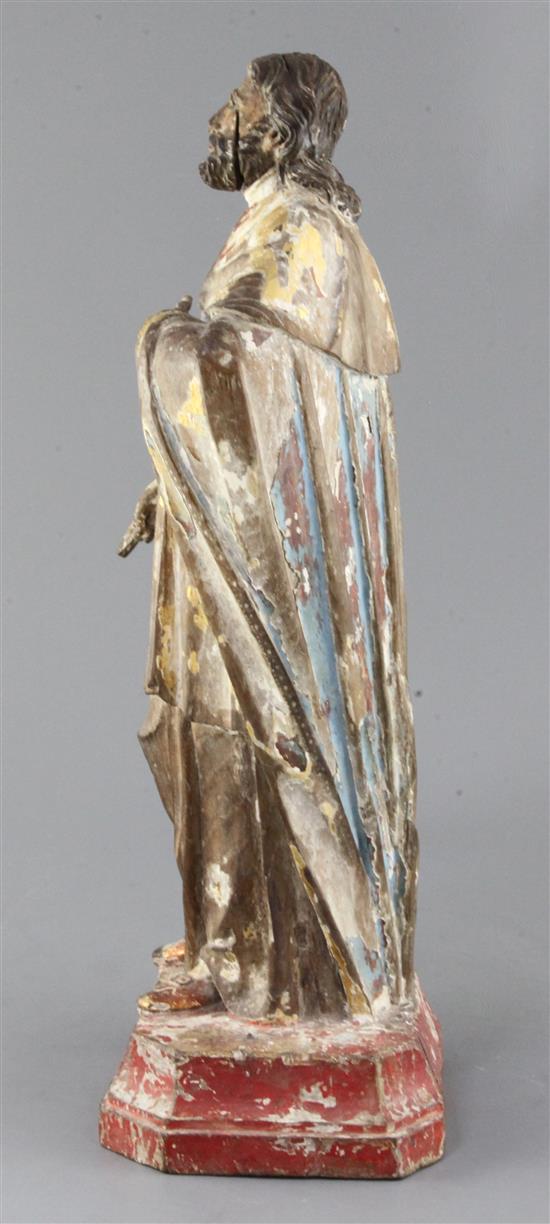 A Brazilian gilt and polychrome-painted carved wood figure of a saint, 18th century, height 17in.